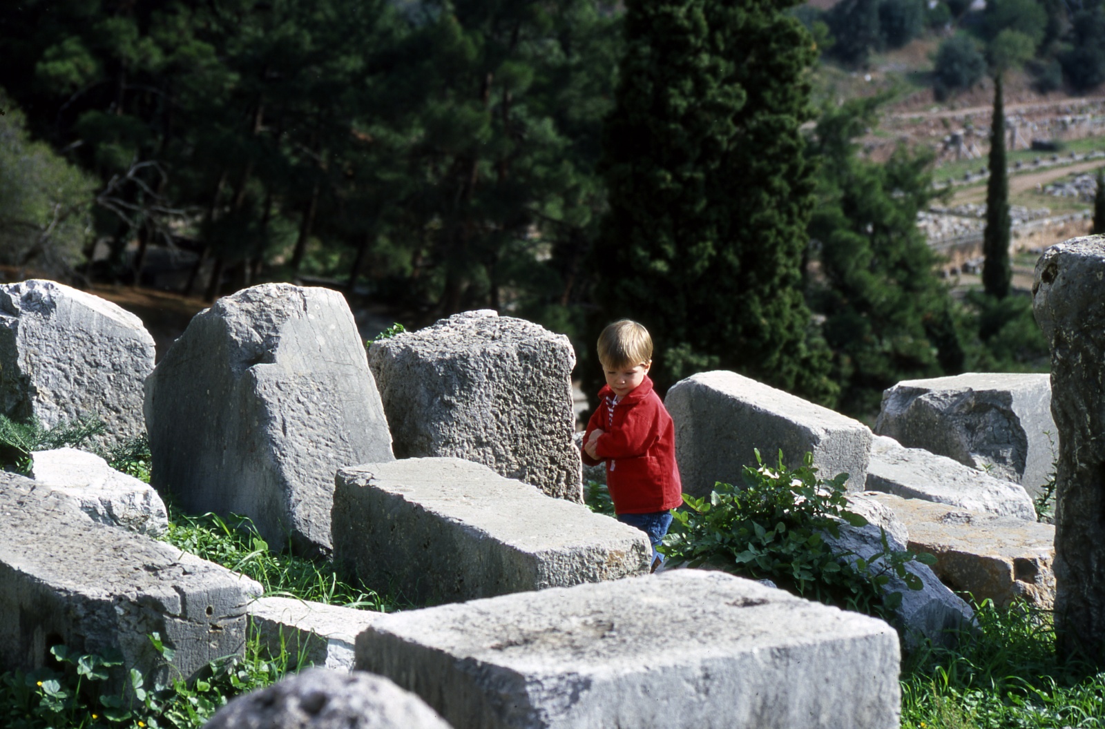 Child walking in the ruins